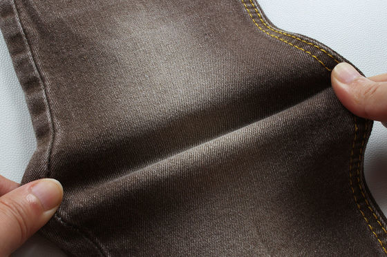 Καλή τιμή Υπερ καφέ τζιν υφάσματα για γυναίκες άνδρες τζιν χαμηλή τέντωμα ανταγωνιστική τιμή από την Κίνα πόλη Foshan σε απευθείας σύνδεση